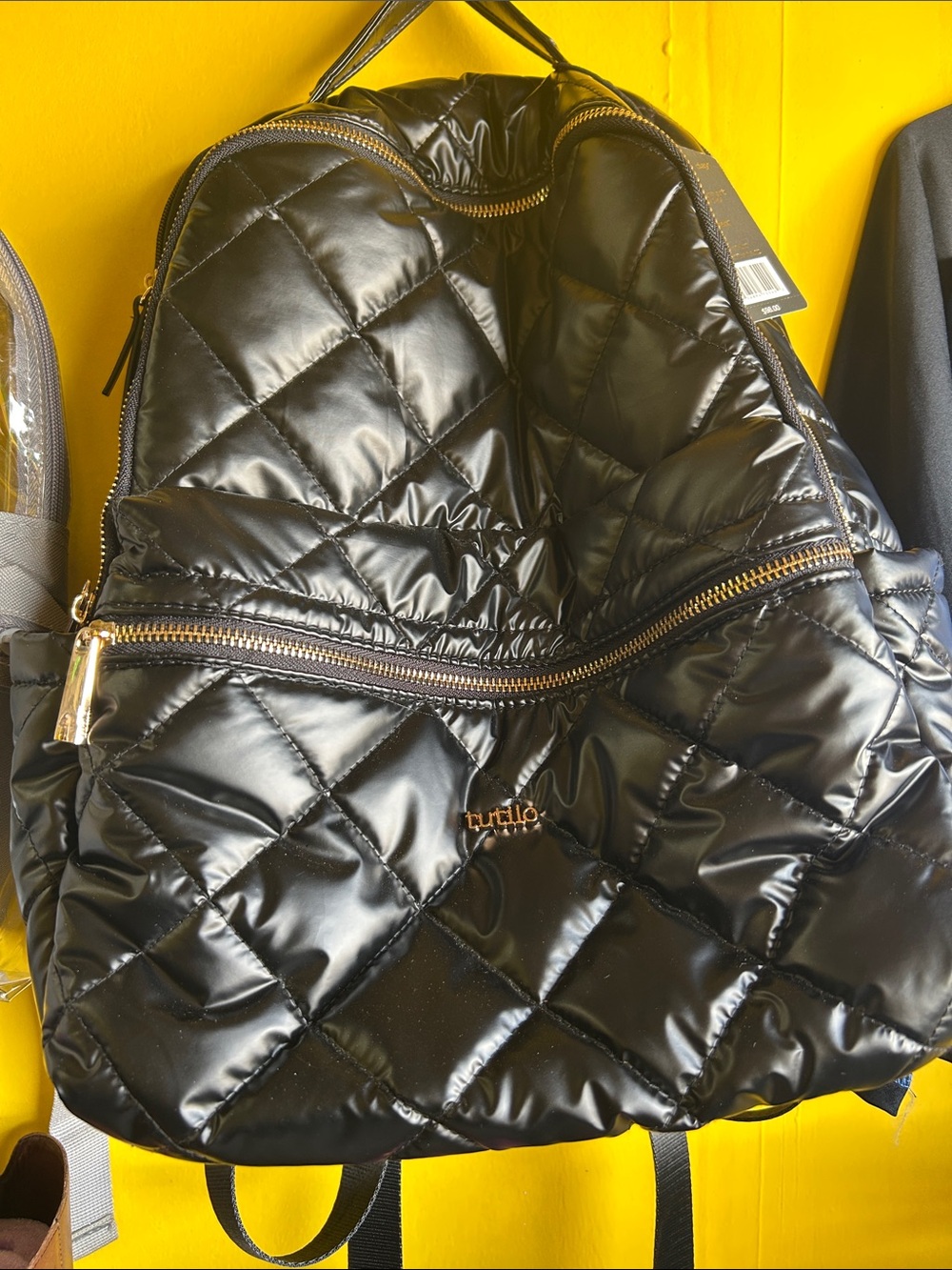 Tutilo Quilted Black Puffer Backpack with Gold Accents